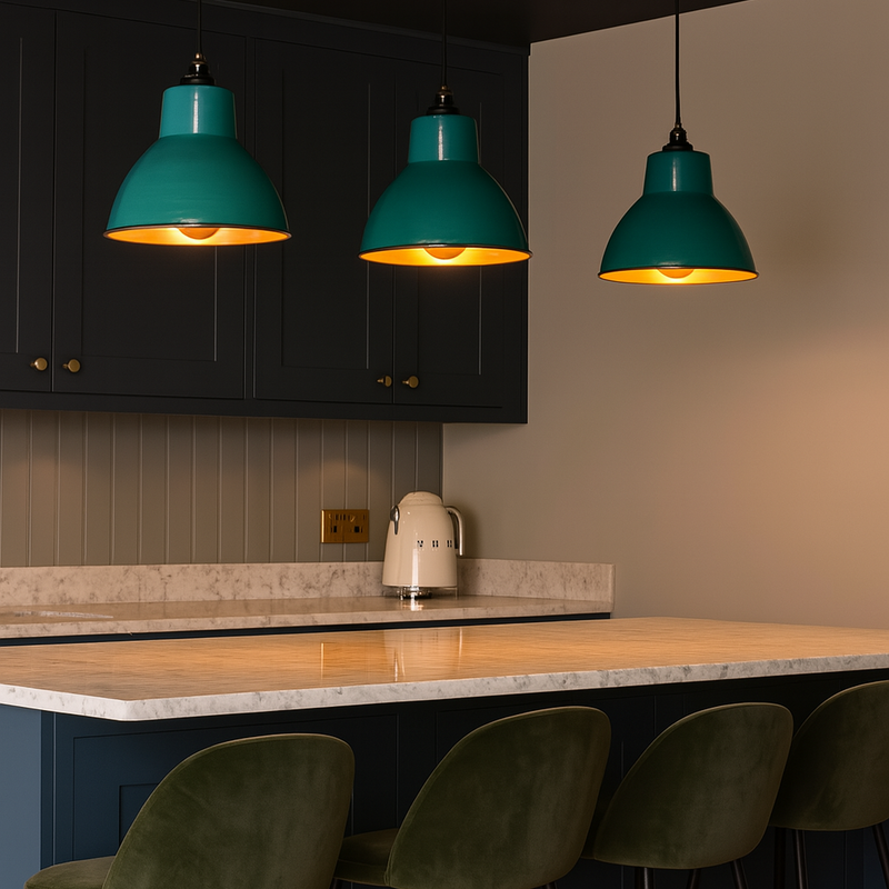 Add a bold pop of colour to your kitchen or dining space with these Teal Enamel Industrial Pendant Lights, designed to combine vibrant style with practical illumination. Featuring a high-gloss teal enamel finish and a warm copper-toned interior, these ceiling lights deliver both striking aesthetics and functional downlighting — ideal for breakfast bars, kitchen islands, or dining areas.
The durable metal shade offers a classic industrial silhouette, while the reflective copper interior enhances the warm gl