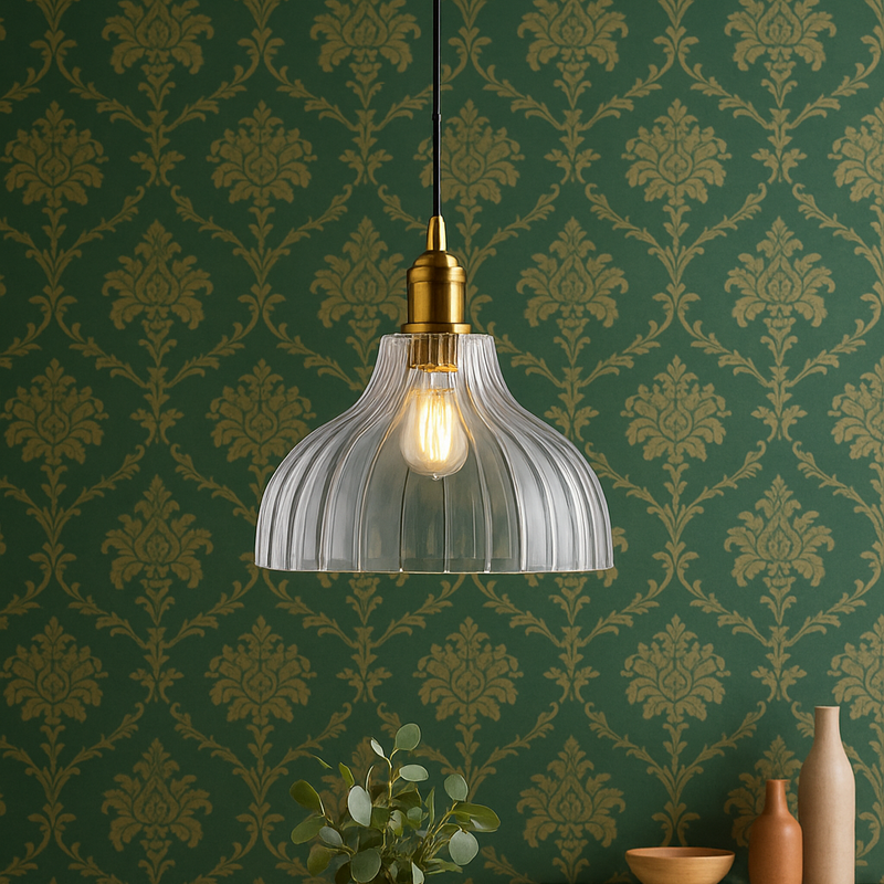 Pendant light hanging above a wooden table with decorative wall paper in the background
