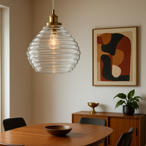 Dining room with wooden table, chairs, and a pendant light fixture.