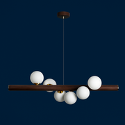 Modern chandelier with white spherical lights and a dark brown wooden arm on a blue background