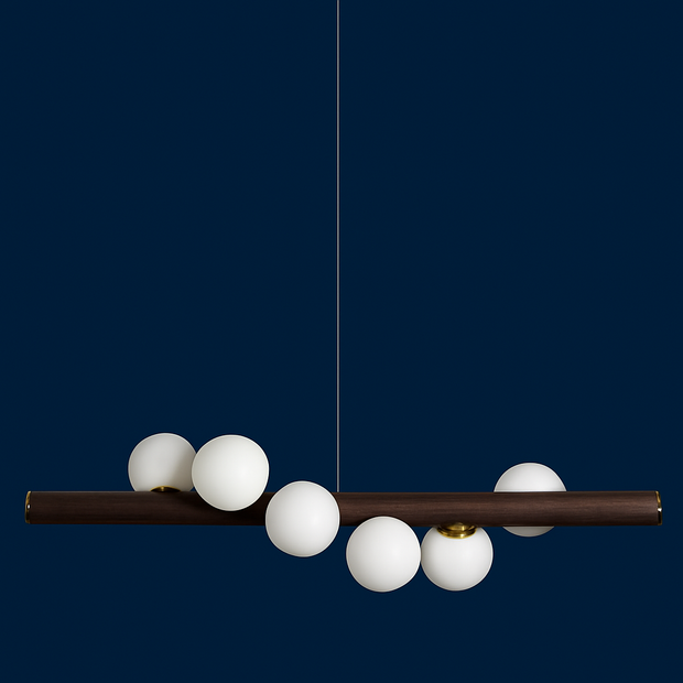 Modern chandelier with white spherical lights on a dark blue background