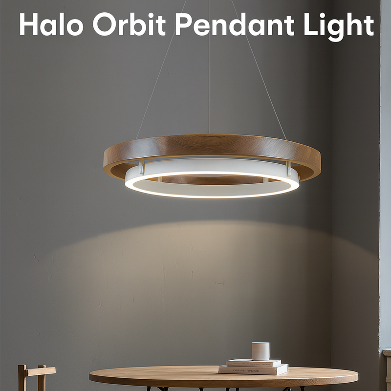 Halo Orbit Pendant Light hanging above a dining table with a chair in a room.