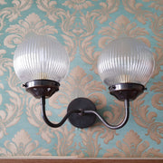 classic double-arm wall sconce with a vintage-inspired design.