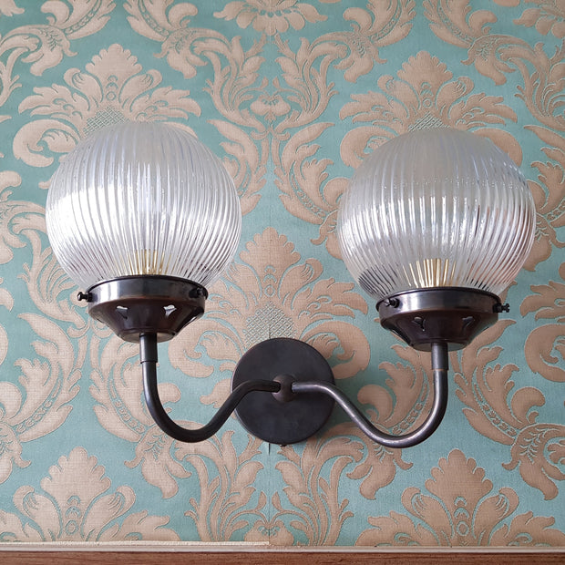 classic double-arm wall sconce with a vintage-inspired design.