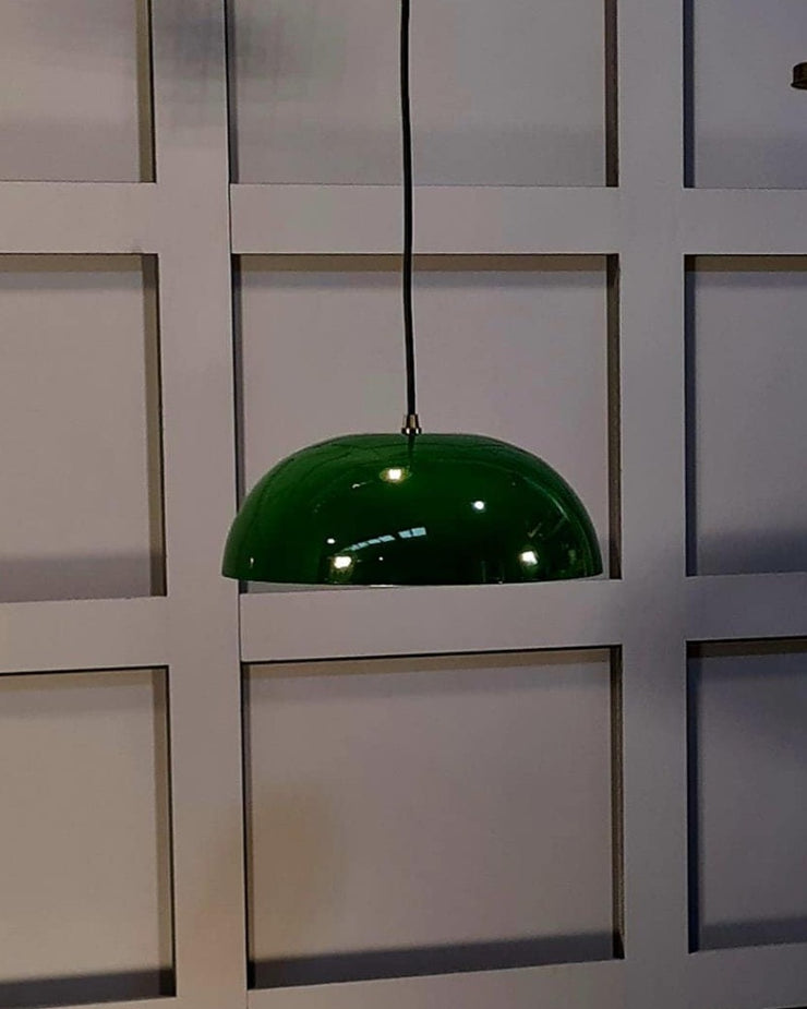 Metal Pendant in British Racing Green with a captivating copper-toned interior, perfect for enhancing your dining table lighting.