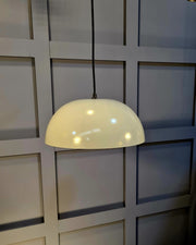 Metal Pendant in Grey Gloss with a captivating Cream-toned interior, perfect for enhancing your dining table lighting.